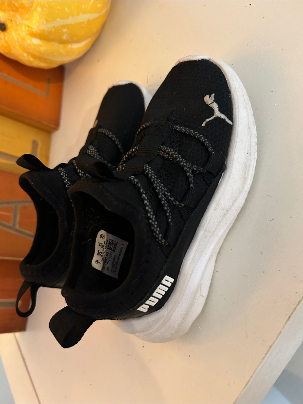 Puma Kids Black and White Slip-On Sneakers